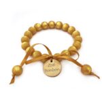Pulsera 1 Marca zoe Bombón 
Dorado brillante.